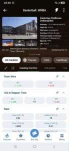 1xBet Android app screenshot: live WNBA basketball match with arena info, 1X2 and total markets